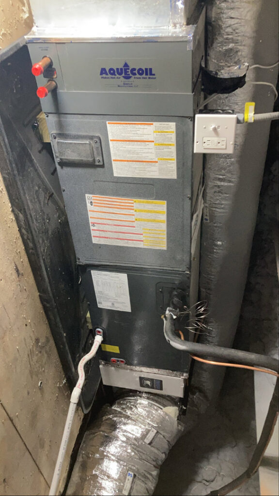 An Aquecoil HVAC air handler unit with ductwork connections installed by Freedom Air Mechanical Contractors LLC in Everett, MA.