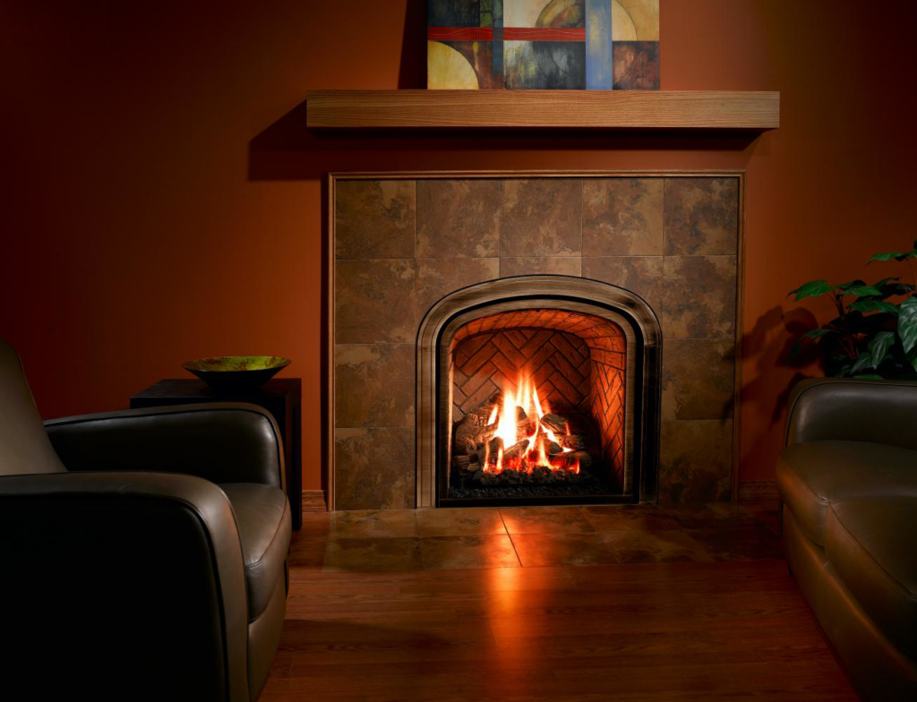 A beautifully installed arched gas fireplace with a tiled surround in a living room by North Central Service, Inc. in Minot, ND.