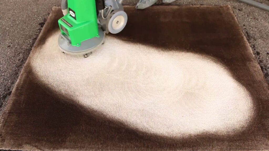 A Chem-Dry machine cleaning an area rug, showing a clear before and after result by ABC Chem-Dry St. Louis in St Charles, MO.