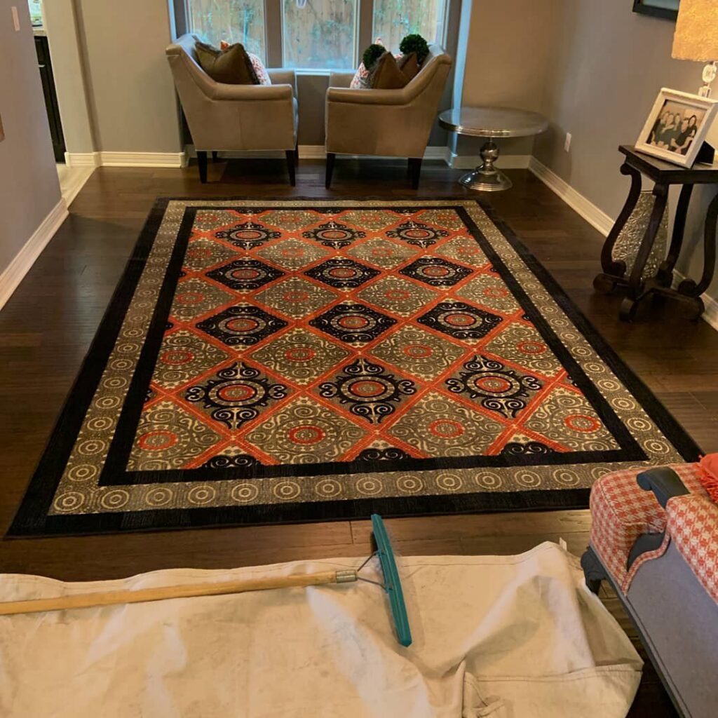 Area rug cleaning equipment and drop cloth set up for a job by Evolution Carpet Cleaning in Fresno, CA