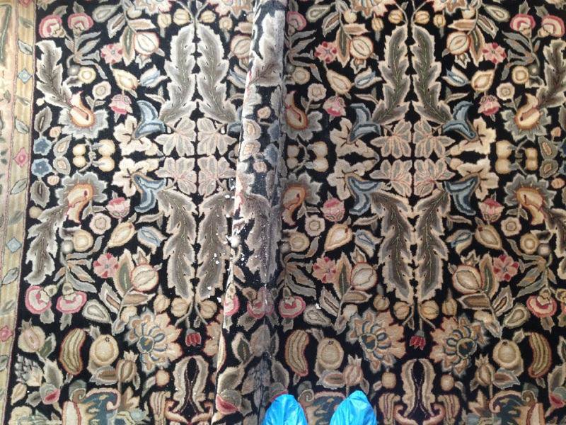 An area rug being cleaned, showing a clear before and after section by Ecodry Carpet Cleaning Las Vegas, NV.