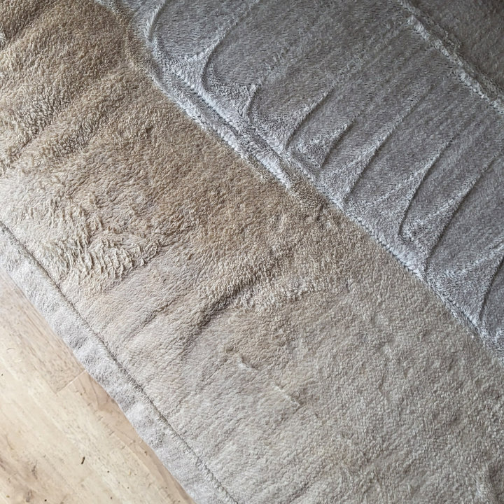 An area rug showing a clear before and after cleaning contrast by My Carpet Cleaner Nashville, TN