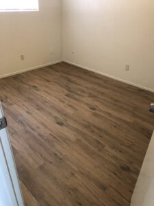 Several colorful area rugs laid out on a driveway, drying after professional cleaning by Superior Carpet Care in Fresno, CA.