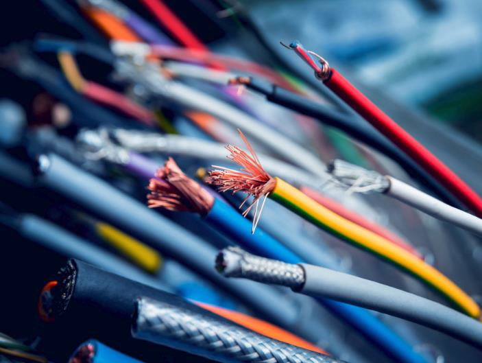 A close-up view of assorted electrical wires and cables, some stripped, representing the work of Affordable Electric, LLC in Kearney, NE.