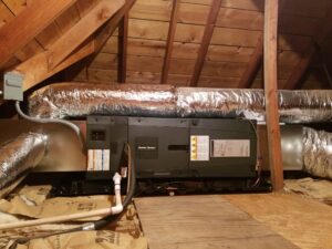 An indoor air handler unit with insulated ductwork installed in an attic space by Crouch's Heating & Cooling LLC in Stillwater, OK.