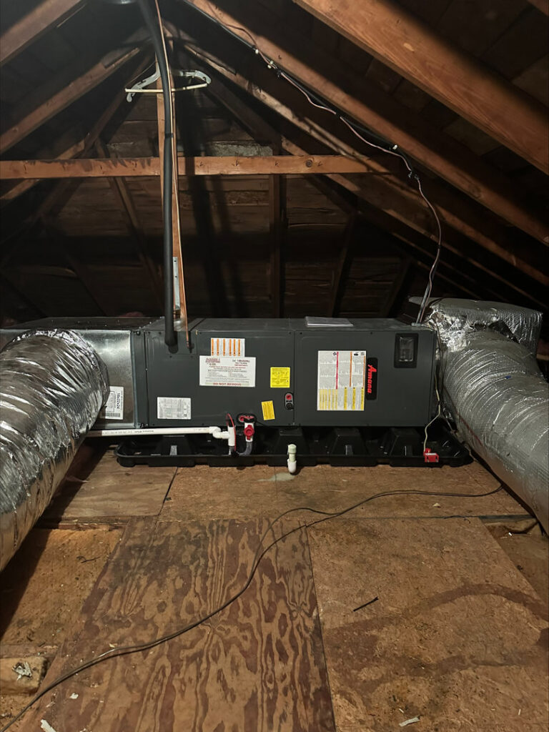 An air handler unit and insulated ductwork installed in an attic by Dodrill Comfort & Energy Solutions in Cross Lanes, WV