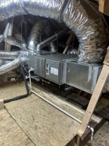 An indoor air handler unit with extensive ductwork installed in an attic by Oklahoma Climate Solutions in Oklahoma City, OK.