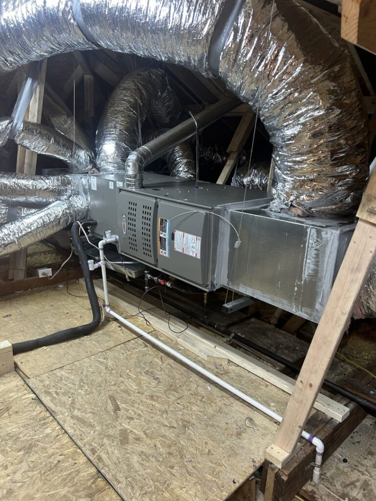 An indoor air handler unit with extensive ductwork installed in an attic by Oklahoma Climate Solutions in Oklahoma City, OK.