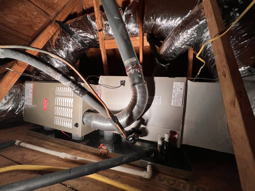 A Bryant air handler and ductwork installed in an attic space by Reliable Heating and Air LLC in Summerville, SC.