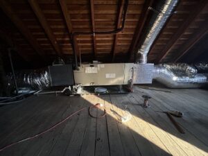 An air handler and furnace unit with ductwork installed in an attic by Express Home Services LLC in Las Vegas, NV