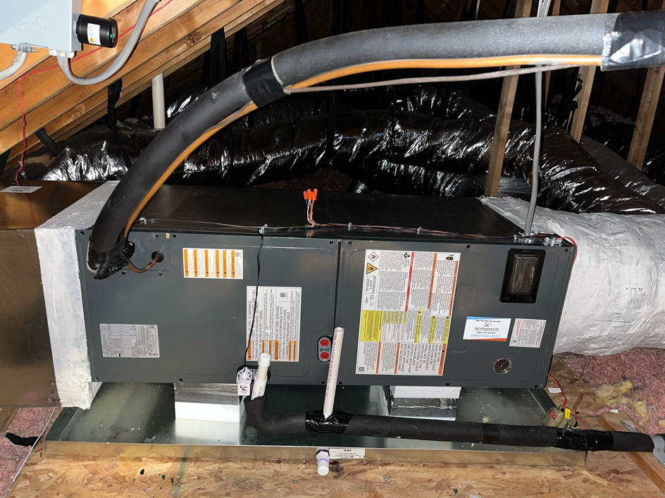 An air handler and ductwork installed in an attic by Joe's Heating & Air Repair LLC in Surf City, NC