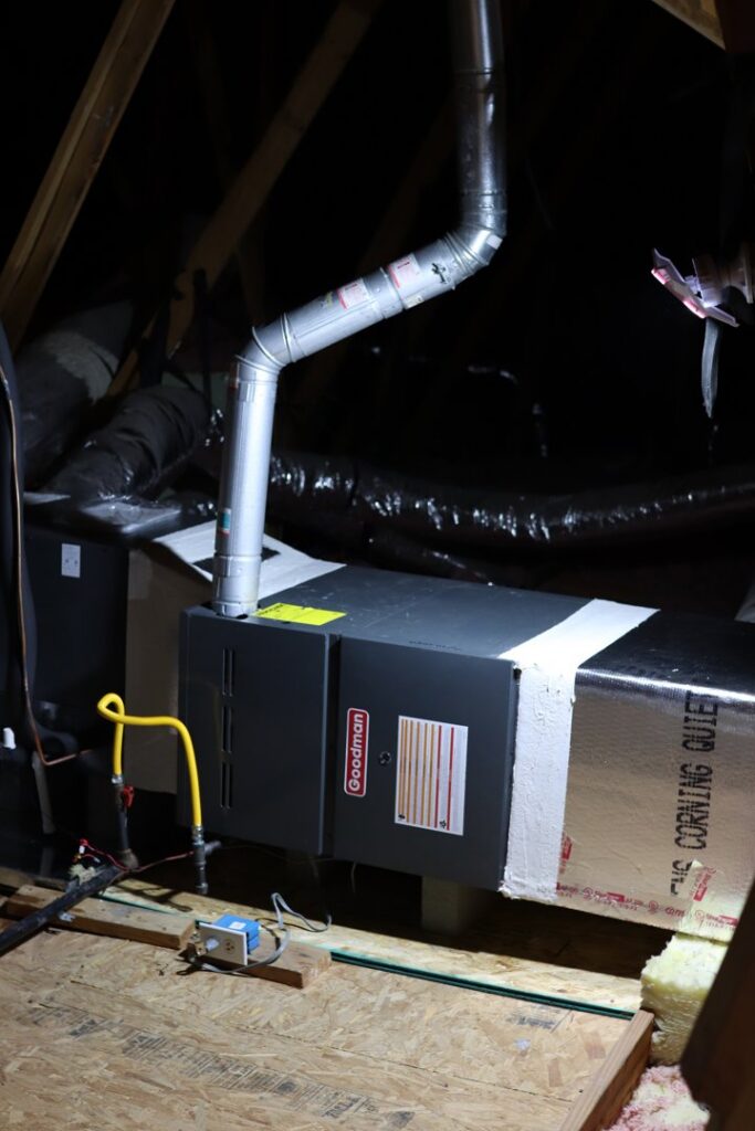 An air handler and furnace unit installed in an attic by Manuel & Sons Service Co. in San Antonio, TX.