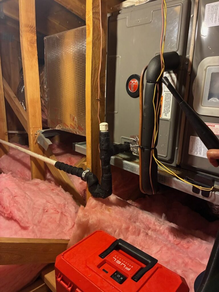 An air handler unit installed in an attic space, showing HVAC work by Air Masters, Inc. in Port Orchard, WA.