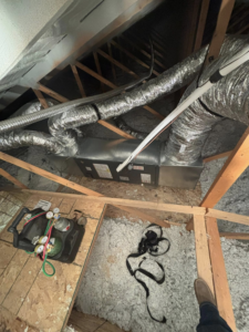 An attic air handler installation with tools by Premier HVAC/ Small appliance in Brooklyn, NY.