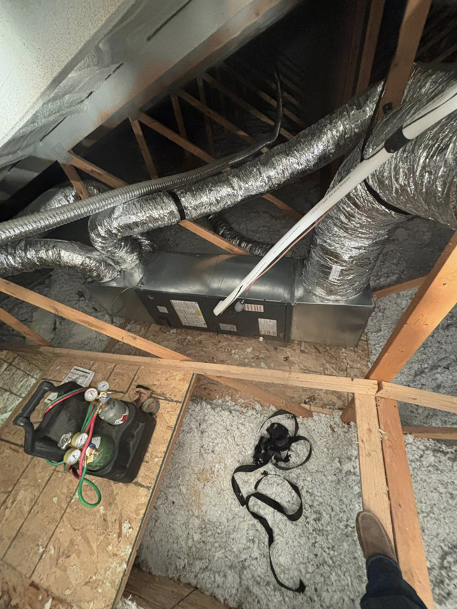 An attic air handler installation with tools by Premier HVAC/ Small appliance in Brooklyn, NY.