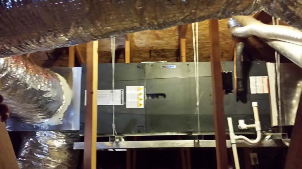 An air handler unit and ductwork installed in an attic by Quantum Cooling & Heating in Mesa, AZ.
