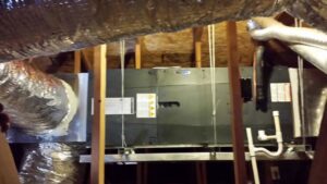 An air handler unit and ductwork installed in an attic by Quantum Cooling & Heating in Mesa, AZ.