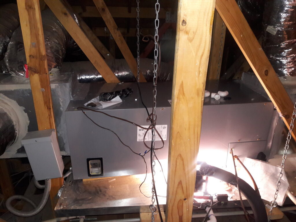 An attic air handler installation with ductwork by Go West A/C & Heating in Fort Worth, TX.