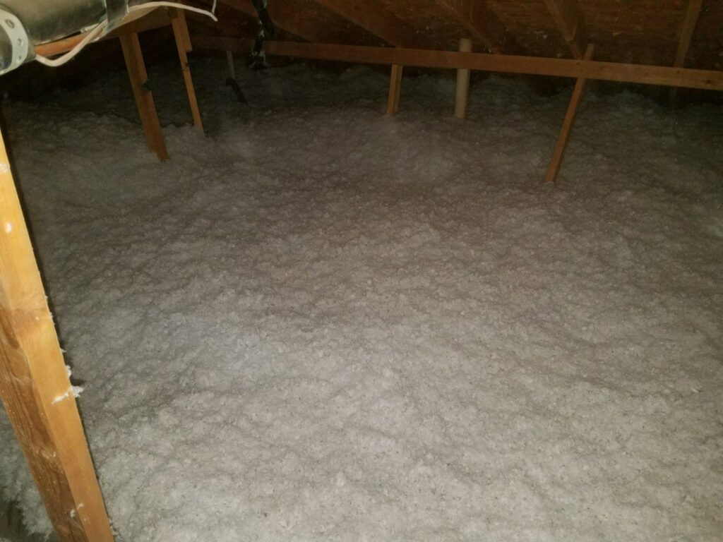 Freshly installed blown-in insulation in an attic by Anderson Refrigeration, Inc. in Poplar Grove, IL, for energy efficiency.