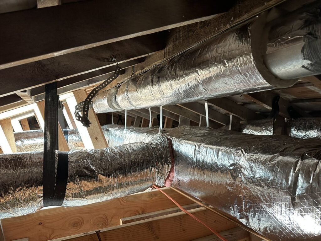 Insulated HVAC ductwork installed in an attic or ceiling space by GreenFlow Heating & Cooling in Tacoma, WA