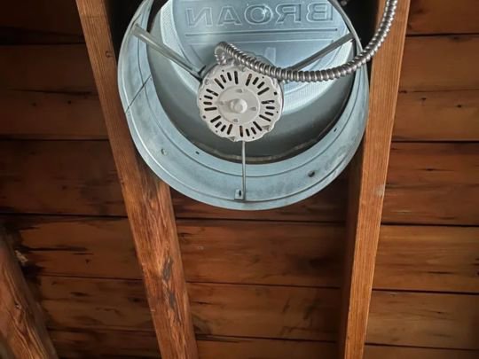 An attic fan installation with visible wiring, expertly handled by Decatur Electrician Now in Decatur, AL.