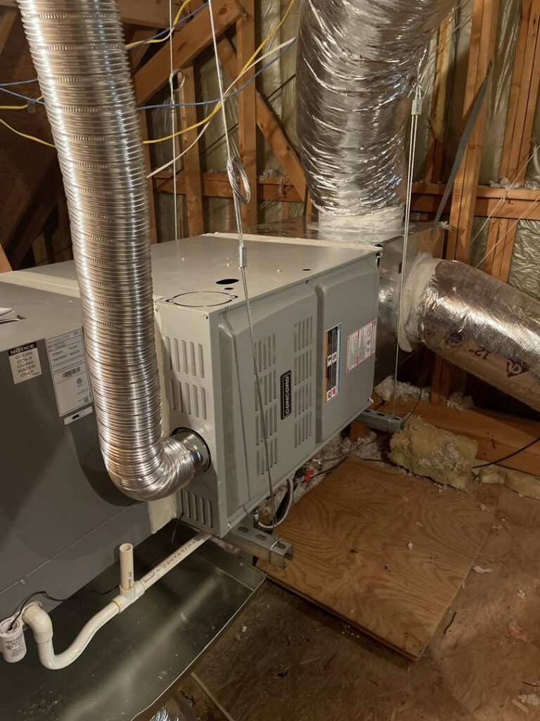 An attic furnace and air handler unit with connected ductwork, installed by Jupitair for a home in Frisco, TX.