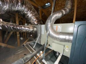 An attic furnace unit with flexible ductwork installed by Sun Devil Heating & Cooling INC in Peoria, AZ.