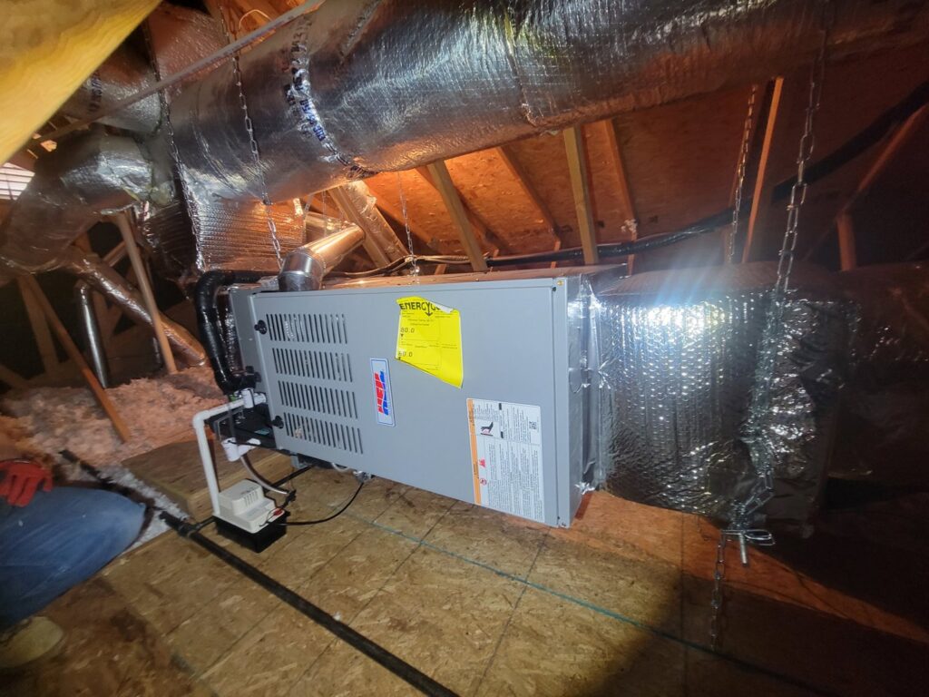 A furnace and ductwork installation in an attic by Pacheco Air Conditioning and Heating LLC in Albuquerque, NM.