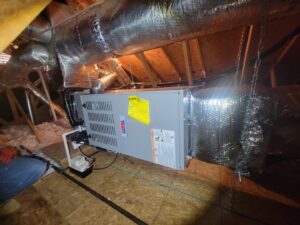 A furnace and ductwork installation in an attic by Pacheco Air Conditioning and Heating LLC in Albuquerque, NM.