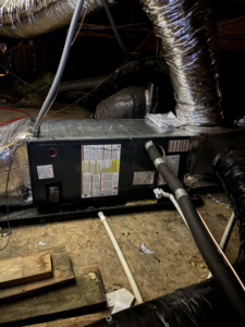 An attic HVAC air handler unit with insulated ductwork, installed by AAA Heating & Air Conditioning Service Inc. in Lexington, KY.