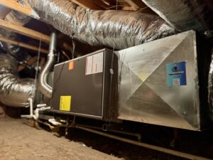 An HVAC air handler unit and ductwork installed in an attic by Mi Amigo HVAC in Surprise, AZ