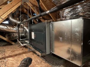 An HVAC air handler unit and ductwork installed in an attic space by AZ Perfect Comfort in Phoenix, AZ.