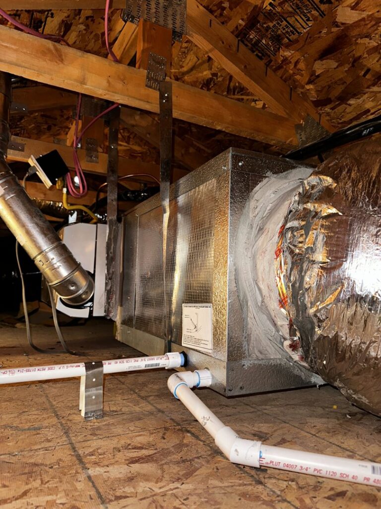An HVAC air handler unit with new ductwork in an attic by Dakine Heating & Cooling, LLC in Las Vegas, NV.