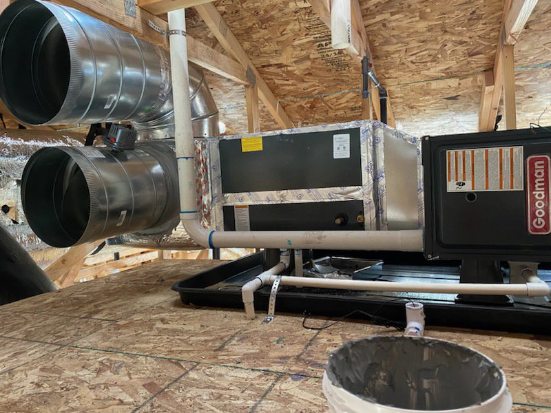 An HVAC air handler unit and extensive ductwork installed in an attic during new construction by Integrity Heating And Air LLC in Nampa, ID