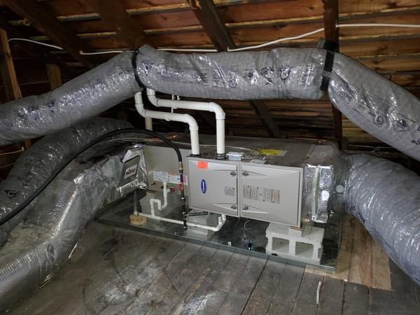 An attic HVAC air handler unit with insulated ductwork installed by Perfect Comfort Systems in San Bernardino, CA