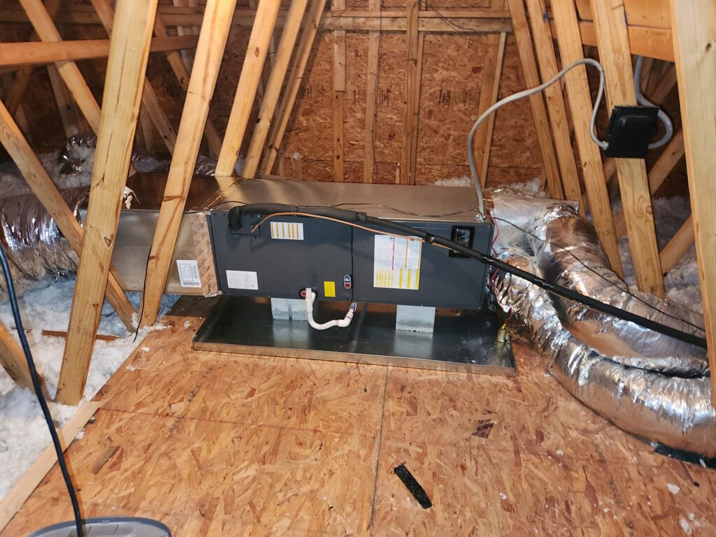 An HVAC air handler unit and ductwork installed in an attic by Borte Mechanical Services LLC in Chesapeake, VA