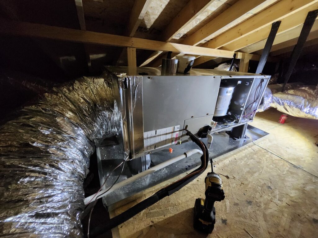 An HVAC air handler unit and ductwork installed in an attic by Recovery HVAC in Smyrna, TN.