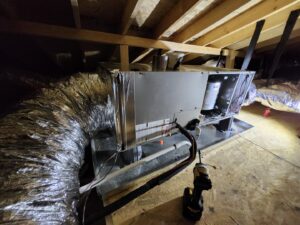 An HVAC air handler unit and ductwork installed in an attic by Recovery HVAC in Smyrna, TN.