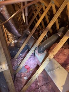 HVAC ductwork and insulation visible in an attic space, installed by Dodrill Comfort & Energy Solutions in Cross Lanes, WV