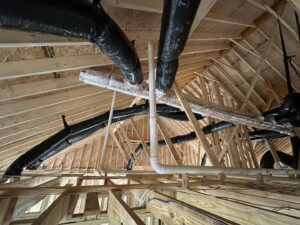 Extensive HVAC ductwork installation in an attic space during new construction by Federal Heating & Cooling in Dresden, OH.