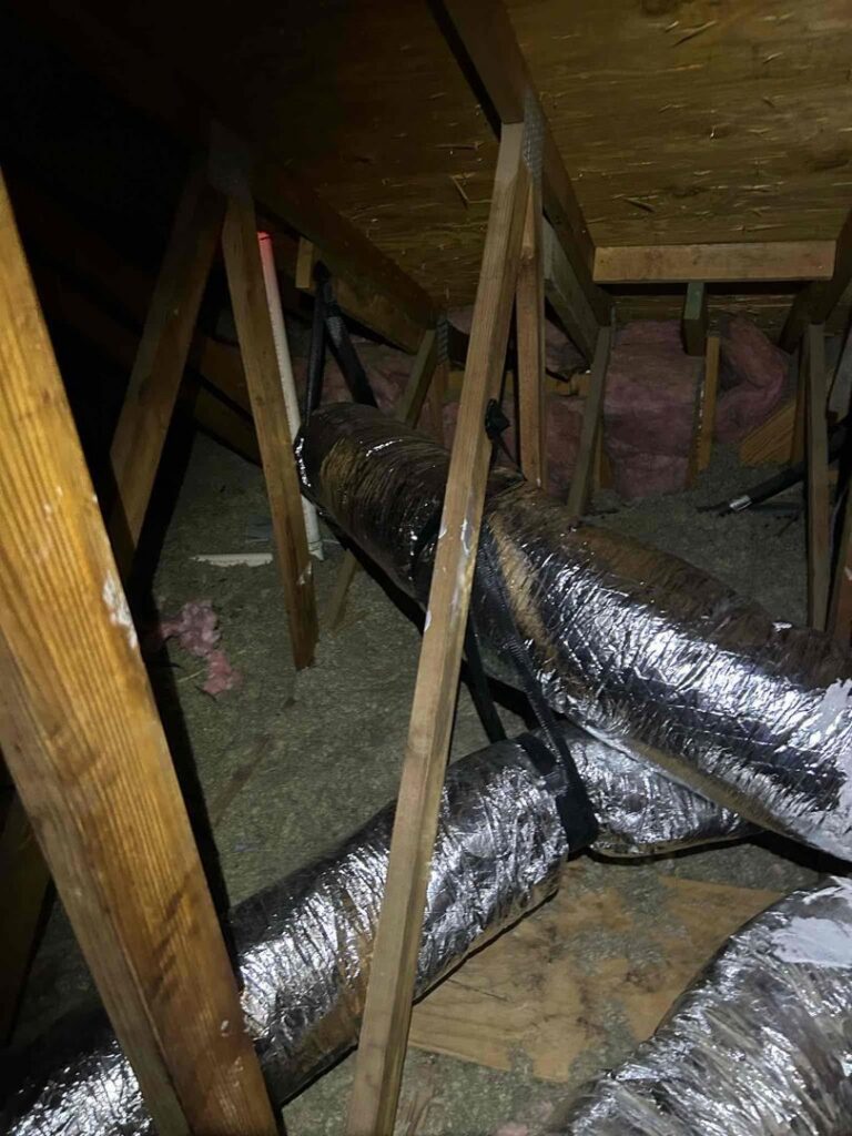 Insulated HVAC ductwork installed in an attic by Manuel & Sons Service Co. in San Antonio, TX.