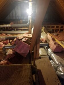 Attic space showing HVAC ductwork and insulation installed by Assured Energy Solutions in Frankfort, IL.
