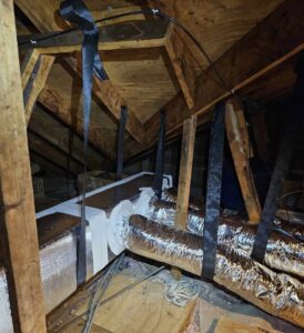 Insulated HVAC ductwork system installed in an attic, showcasing work by Budget Heating and Air in Mobile, AL.