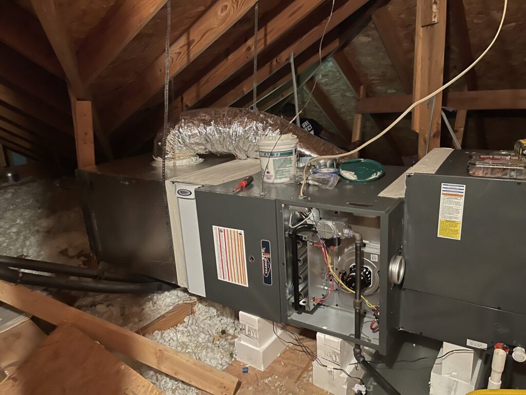 An HVAC furnace and ductwork being installed in an attic by Goettl Austin in Austin, TX