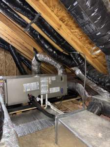 An attic HVAC system with extensive ductwork and an air handler, serviced by AAA Heating & Air Conditioning Service Inc. in Lexington, KY.