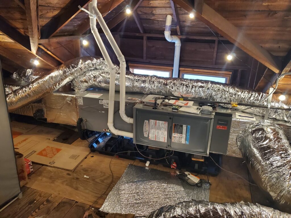 An attic HVAC system installation with insulated ductwork by AccuMax Incorporated in Aurora, IL.