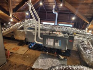 An attic HVAC system installation with insulated ductwork by AccuMax Incorporated in Aurora, IL.