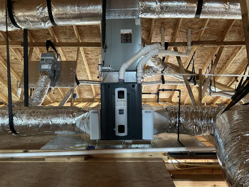A complete HVAC system with ductwork installed in an attic by Chapman HVAC in Cleveland, OK.