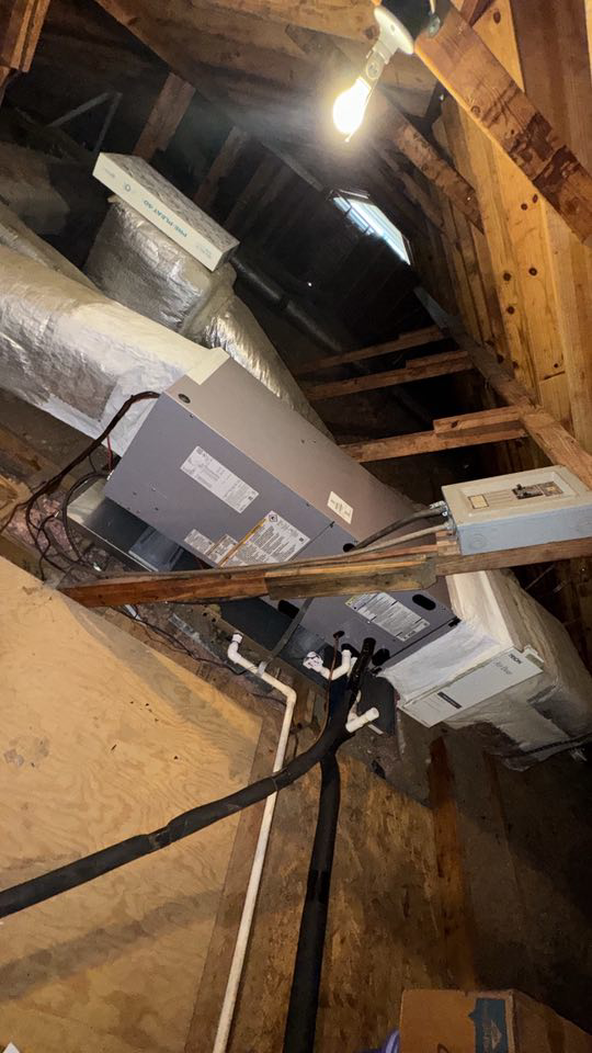 An HVAC system with an air handler and ductwork installed in an attic by Kirk Heating & Air Conditioning in Summerville, SC.