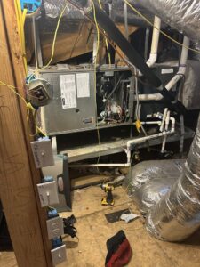 An attic HVAC system undergoing installation or repair with tools by Sonnyreena Mechanical LLC in Garland, TX